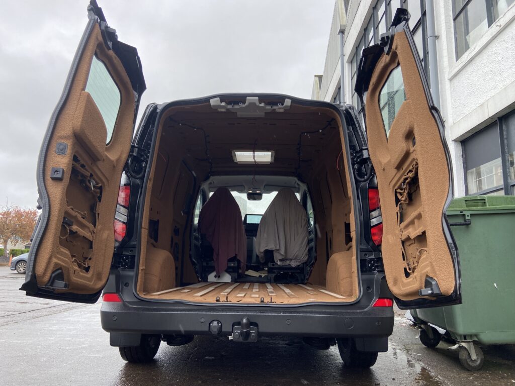 spray cork insulation on a brand new 2026 Ford Transit Custom Trail