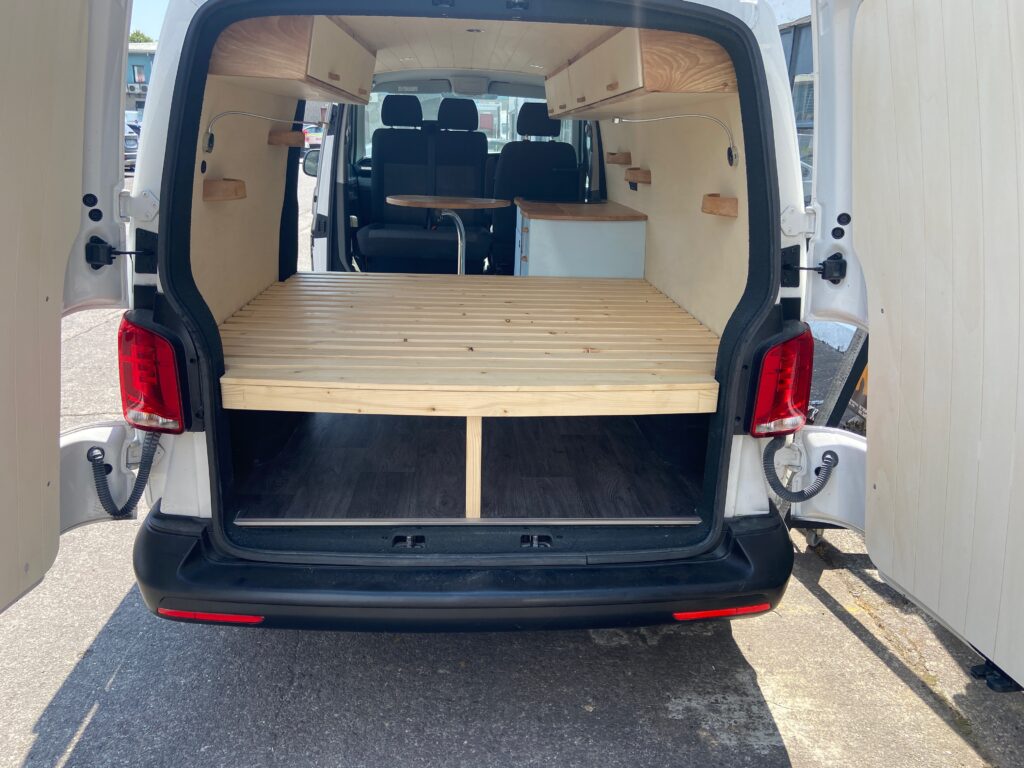 view from the back into our 2026 VW Transporter T6.1 bespoke Unfollow campervan conversion