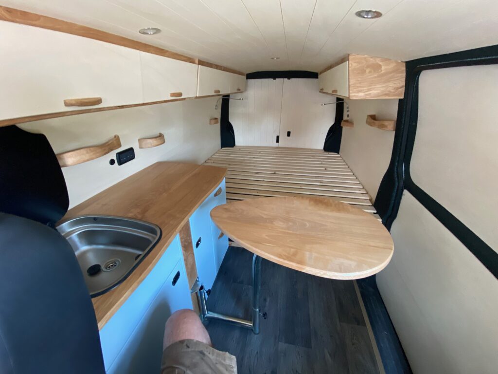 a view front to back of our 2026 VW Transporter T6.1 bespoke Unfollow campervan conversion
